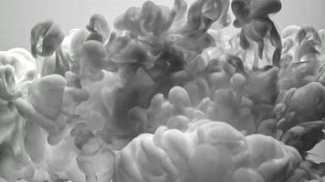 Gray ink swirling in water video