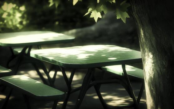 Green Picnic Table Under Shade of Tree in Tranquil Outdoor Setting photo