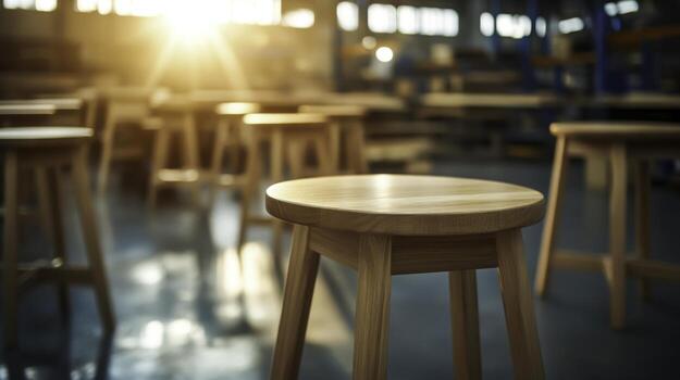 Wooden Bar Stools in Workshop with Warm Lighting and Soft Focus Background photo