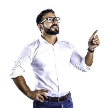 Confident businessman with glasses pointing upwards in a bright studio setting on white background photo