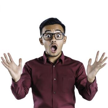 Surprised Young Man Reacting with Wide Eyes and Open Hands in a Dynamic Pose photo