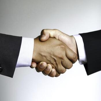 Professional Handshake Between Two Businessmen in Modern Office Setting photo