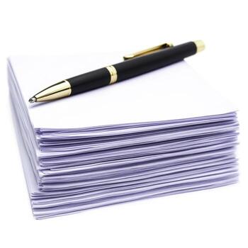 Blank Sheets of Paper with Elegant Pen on Top for Office and Creative Projects photo