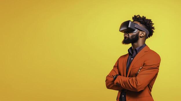 Stylish man in virtual reality headset with vivid yellow background showcasing modern technology photo