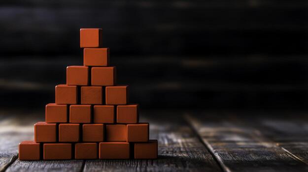 Red Wooden Building Blocks Forming a Pyramid on a Rustic Wooden Surface photo