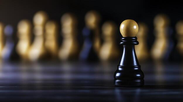 Black pawn chess piece in focus with blurred wooden pieces in the background photo