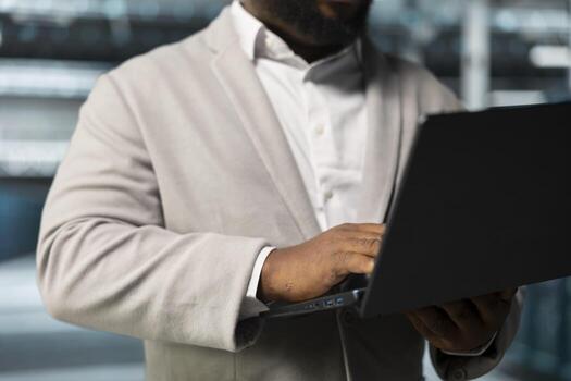 Close up of admin in data center workspace running system diagnostic tests, monitoring performance. IT expert in server hub looking for network issues affecting rigs performance, upgrading hardware photo