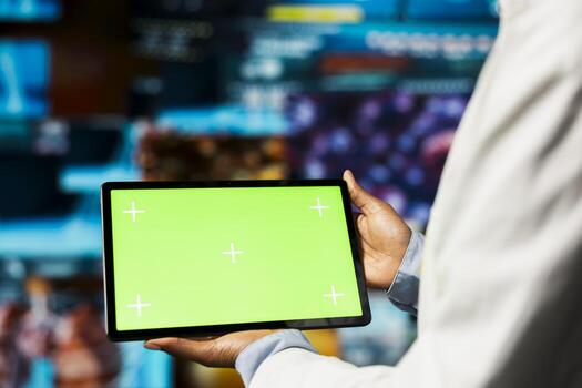 Close up of researcher using isolated screen tablet, looking at medical data, doing disease prevention. Scientist doing treatment development, looking at patient scans on mockup device application photo