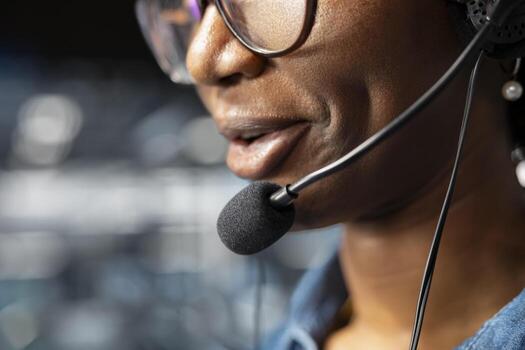 Close up of black female IT engineer does remote troubleshooting on AI visualization for data center operations, ensuring technical workflow and automation on industrial platform. photo
