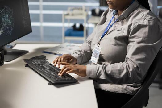 Close up of server farm admin looking at data visualization on PC to pinpoint equipment performance issues. Data center IT expert looks at analysis graph to reduce infrastructure failures photo