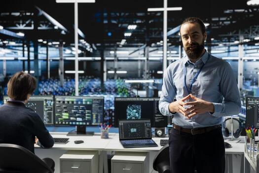 Data center manager presents AI tech to shareholders, demonstrating predictive maintenance capabilities. Man briefing investors on server farm artificial intelligence infrastructure photo