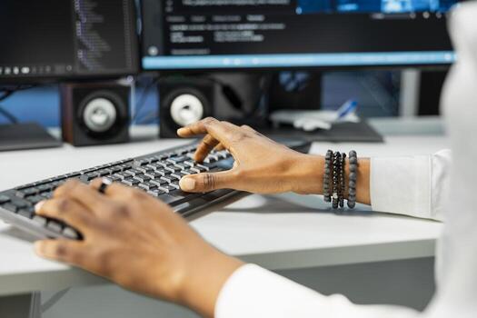Close up of IT expert typing on PC keyboard in server hub with hardware supporting data mining. Computer scientist working in data center to do maintenance on rigs using device photo