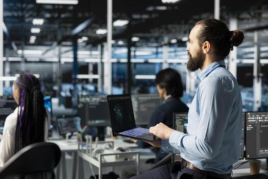 Teamworking engineers in data center installing upgraded server racks systems helped by AI technology. Server room colleagues upgrading enterprise networks equipment using artificial intelligence photo