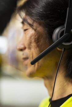 Close up of customer service clerk in depot working on order mix up in e-commerce parcel status, managing shipment details and order fulfillment questions. Call center help line. photo
