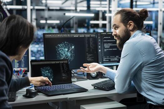 Teamworking colleagues use AI assistant analysis to optimize performance of supercomputers. Team of data center IT specialists speeding up tasks by following LLM chatbot suggestions photo