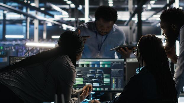 Data center teamworking programmers using node tree tool to identify infrastructure performance issues. Server hub colleagues working together reviewing data analysis graph photo