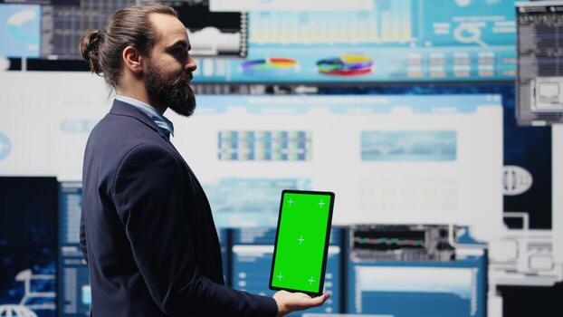 Entrepreneur using isolated mockup screen for a digital analysis, ensures financial planning and business success with digital growth driven tools and monthly reports. Insightfulness. Camera B. photo