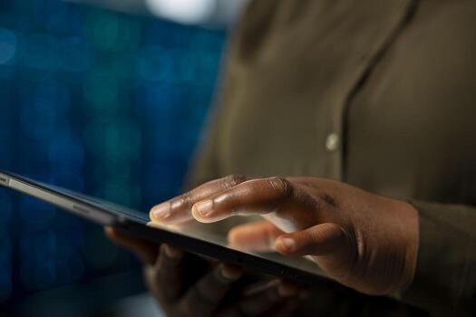 Close up of data center engineer installing and configuring hardware used for hosting digital services. Server farm employee testing and repairing rigs managing file transfers photo