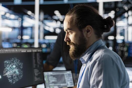 Data center technician programming diagnostic scripts on PC, examining infrastructure. Close up of server farm employee evaluating performance metrics, running tests to maintain system stability photo