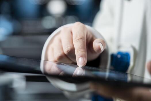 Close up of astronaut using tablet to confirm suit integrity, verifying mission parameters. Orbital station crew member testing gear during routine equipment check, troubleshooting hardware photo