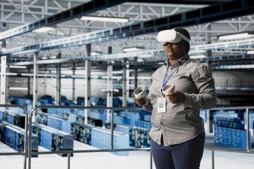 Server room worker using VR gear to improve gear performance, upgrading rigs. Data center engineer using virtual reality technology to analyze datasets, managing infrastructure systems photo
