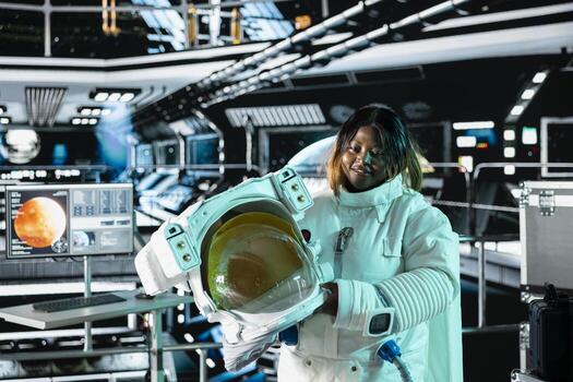 Jolly astronaut analyzing Mars planetary data in spacecraft powered by advanced engineering. Upbeat starship crew member exploring deep space, doing Martian surface research photo