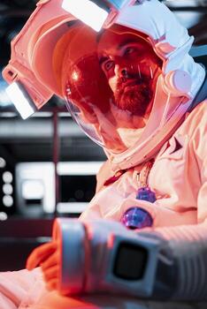 Astronaut starting to lose consciousness from low oxygen levels after life support malfunction. Space station crew member blacking out from environmental hazard triggering red light alert photo