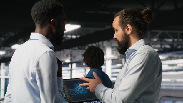 Server farm coworkers doing infrastructure AI machine learning automatization. Data center computer scientists collaborating to maintain servers using artificial intelligence photo