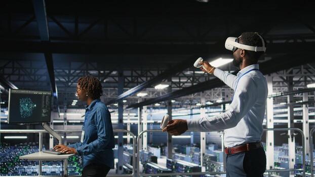 Data center admin using VR headset to monitor neural network AI systems. Server room employee using virtual reality tech to oversee equipment powering machine learning processes, photo