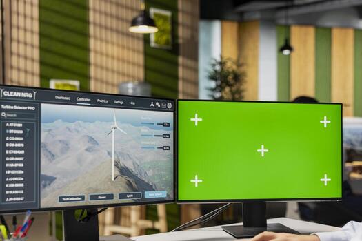 RD professional studies next generation wind turbine technologies on green screen PC to accelerate clean energy adoption. Researcher optimizes aerodynamic design of VAWT turbine using mockup computer photo