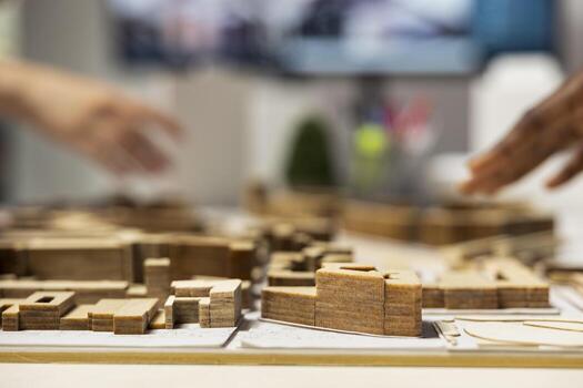 Close up of engineers team creating the property layout for site preparation, using 3D models for urban development and large scale construction project. Infrastructure growth and city planning. photo