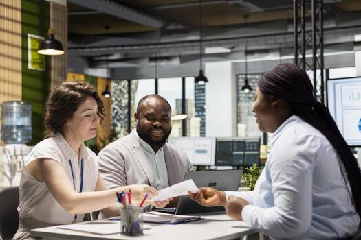 Human resources team conduct CV evaluation with candidate during job interview in a business space, analyzing work experience and qualifications for career development. Talent acquisition. photo