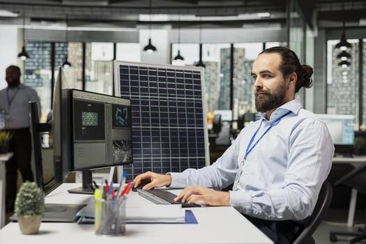 Technician working for green tech company uses CAD app to optimize sustainable solar panel fabrication with advanced assembly lines. Product designer innovates solar cell manufacturing processes photo