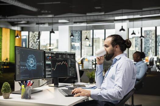 Trader drinking coffee running AI program on PC to do automated trading, doing scalping. Prop firm professional enjoying beverage in office, applying deep learning algorithms to analyze market data photo