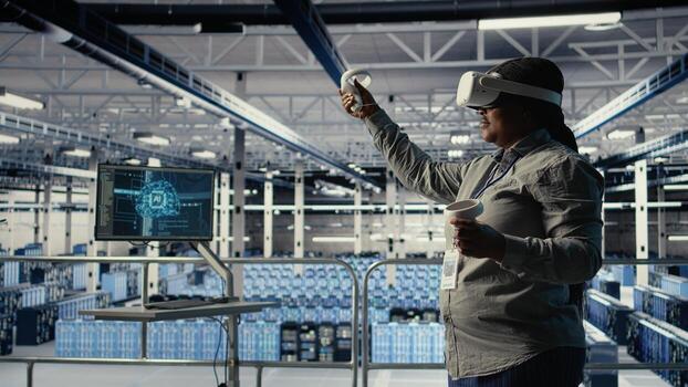 Data center technician using virtual reality, improving AI rigs processing speed. Server hub IT expert using VR headset to manage gear providing support for artificial intelligence workloads, camera A photo