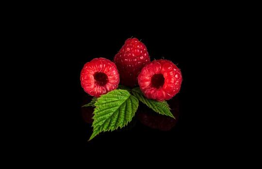 Raspberry isolated. Raspberries with leaf isolate. Raspberry with leaf isolated on black background. photo