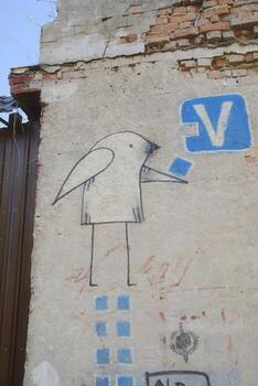 A wall with a bird on it photo