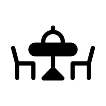 A solid icon of a set dining table with a pitcher and cups. vector