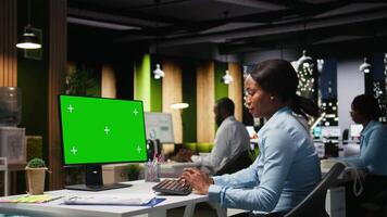 Isolated chroma key on desktop pc with black analyst analyzing KPI metrics, applying a strategic mindset to business development plans. Support innovation and goals achievement. Camera A. video