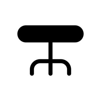 A simple filled icon of a circular or round table for dining or meeting. vector