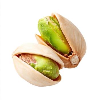 Cracked pistachio nut with green kernel isolated on white background showing clean detail and natural texture healthy snack closeup fresh appetizing vibrant color photo