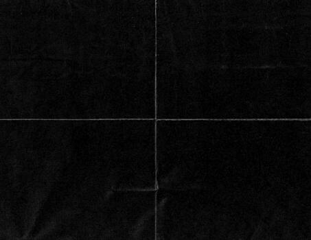 Dark grunge paper texture with distinct cross fold lines, scratches, and worn surface. Vintage distressed background ideal for design, retro artwork, gothic layouts, or abstract projects. photo