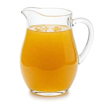 A pitcher of orange juice and ice isolated on white photo