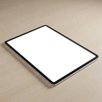 A tablet computer with a mock white screen on a table photo