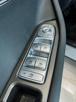 This image depicts a detailed close up view of a car door control panel, showcasing its intricate design and functionality. Its a crucial part of modern automotive technology photo