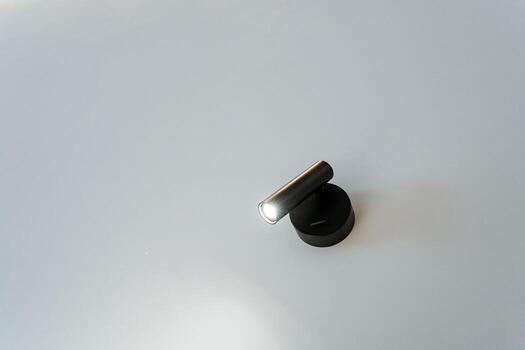 A soft, warm light gracefully illuminates a pristine white surface, generating a sense of comfort and joy, while beautifully enhancing the aesthetics of the entire surrounding environment photo