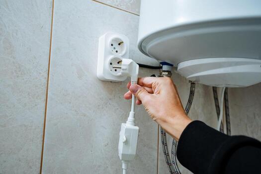 Properly connecting an electrical appliance to ensure its functionality and safety requires you to firmly plug the power cord into a wall outlet when using it in your household environment photo