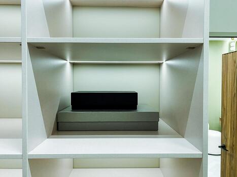The Modern Minimalist Shelf features a sleek design and ambient lighting, enhancing home decor while combining style and function as a valuable addition to luxury furniture collections photo