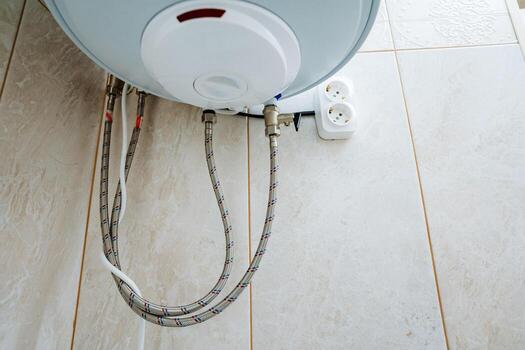 The process for Water Heater Installation involves the proper setup of Connection Hoses along with ensuring a Power Outlet is correctly positioned for functionality and safety during use photo