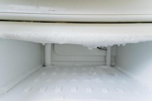 Frost Accumulation in an Unused and Empty Freezer Compartment Can Cause Issues Over Time and Lead to Condensation, Affecting the Freezing Efficiency of Your Freezer in Your Household photo